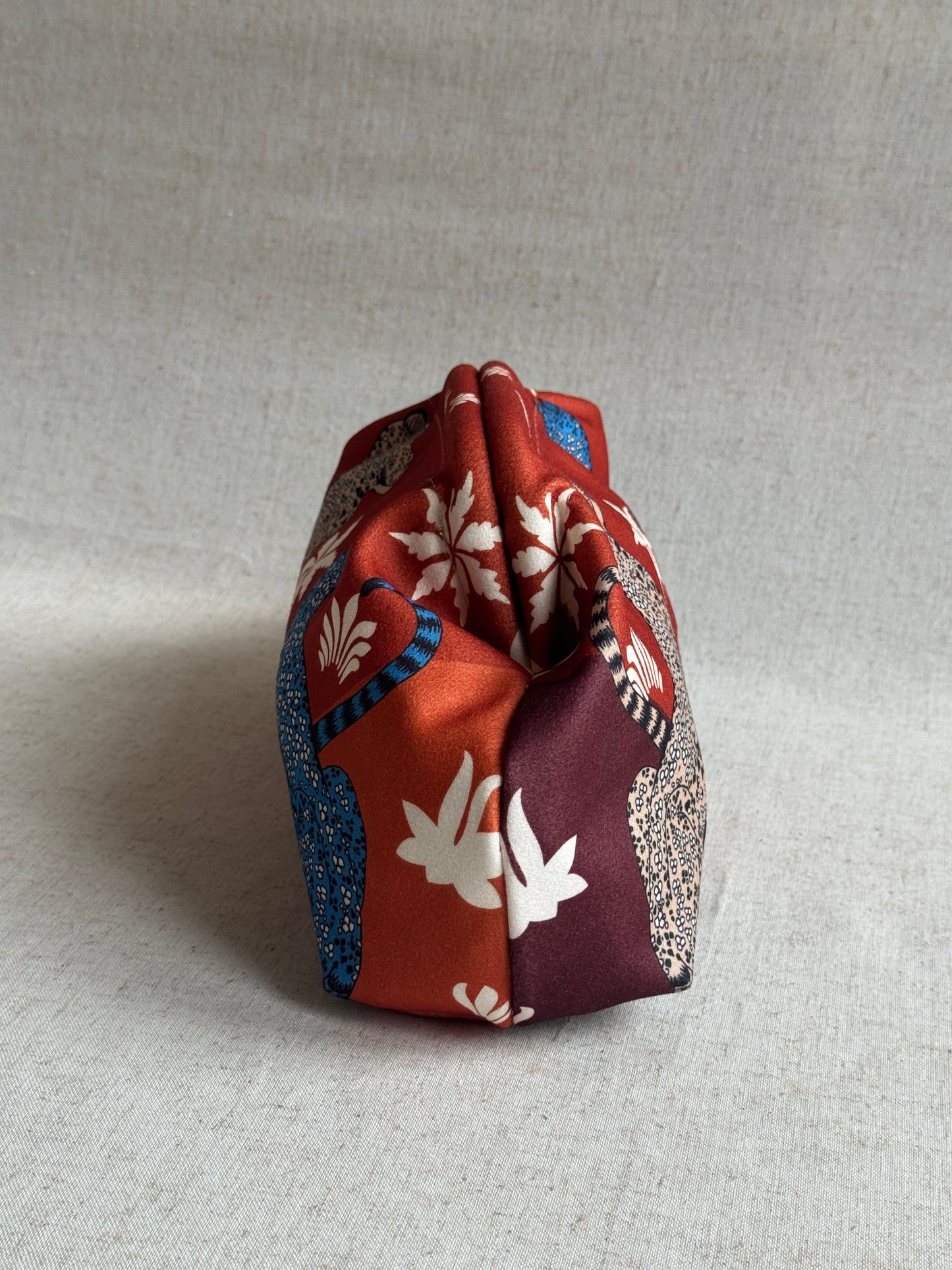 pochette Sicilia - stampa leopardi, con tracolla in catena